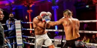Kickbox-Weltmeister: „Kampfsport und Christsein lassen sich gut vereinbaren“ Ertan Bicakci kämpft im Boxring mit einem Gegner.