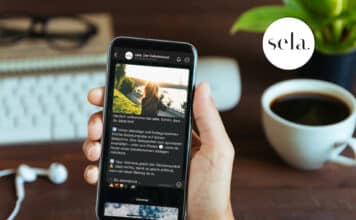 Gebetsimpulse direkt aufs Smartphone Hand hält Smartphone mit Sela-App